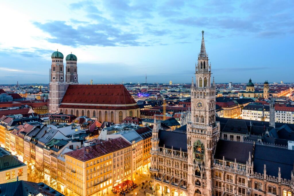 A stunning view of Munich's Marienplatz and Frauenkirche at dusk.